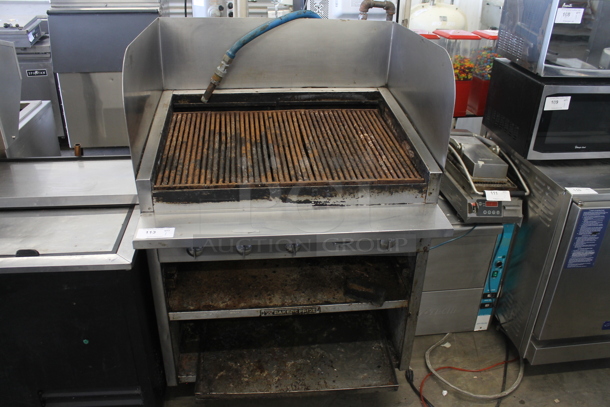 Bakers Pride Stainless Steel Commercial Natural Gas Powered Charbroiler Grill w/ Under Shelves and Splash Guards.